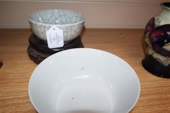 A Chinese crackle glaze bowl, early 20th century blue and white bowl and a wood stand largest diameter 17cm